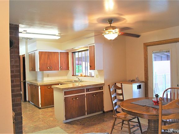 Kitchen and dining room. Granite tile on countertop.