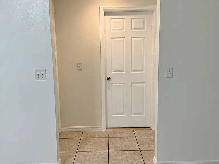 Hallway to:
Master bedroom (left) 
Second bedroom (right)
Second bathroom (straight)