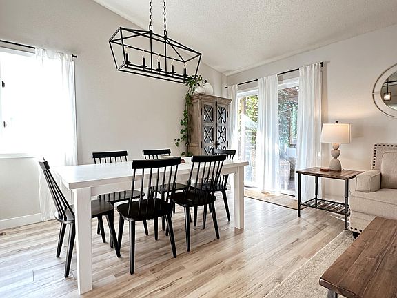 Main level dining room with sliding glass door to backyard & deck