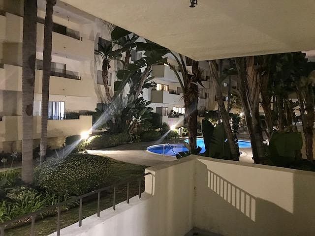 View of community pool and courtyard from private patio