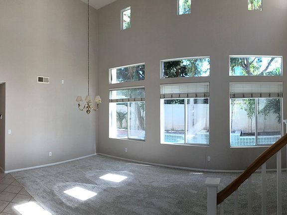 Panorama looking at the living/dining room from the entry way. Bonus room immediately to the left, kitchen and family room down the hall to the left.