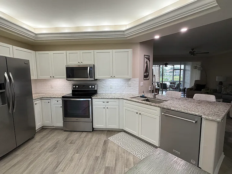 Fully remodeled kitchen, lighting, ceiling fan (out of picture area), accent lights above and under cabinets. Dimmers.