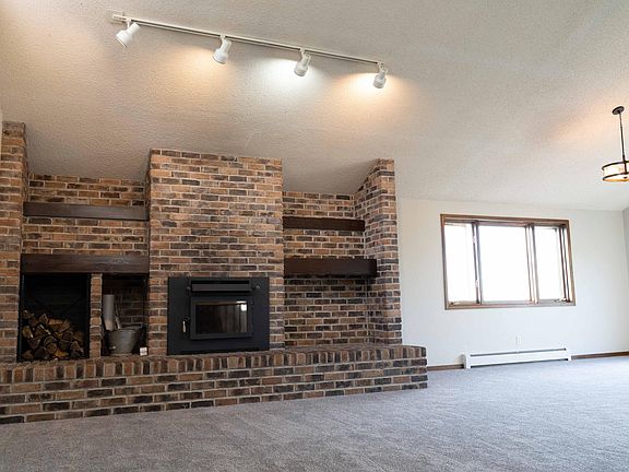 Great room with vaulted ceilings and fireplace