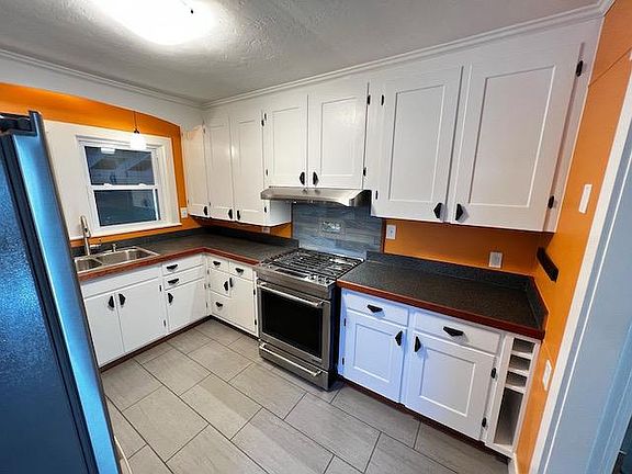 Newly restored kitchen with radiant heat tile floors.