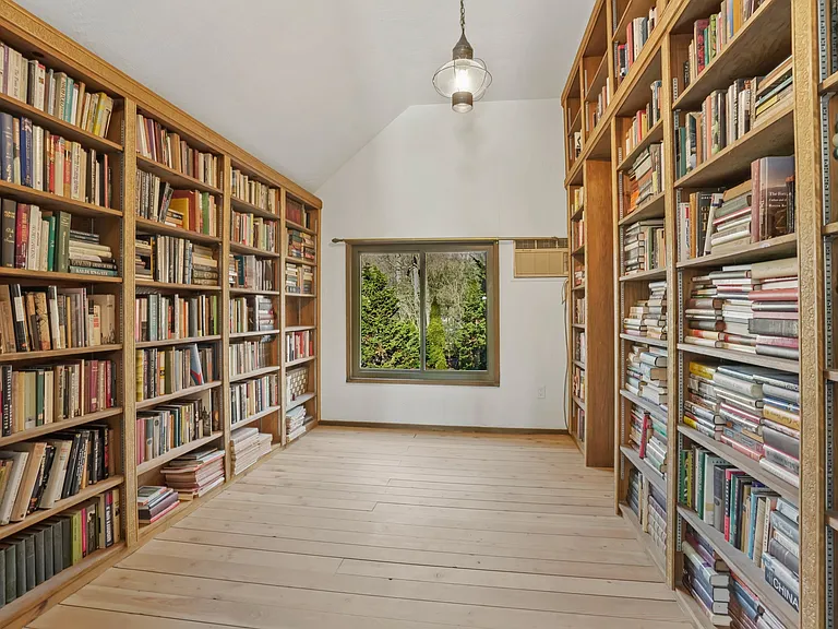 Bedroom/Study located next to Primary Bedroom with access to a Half Bath.