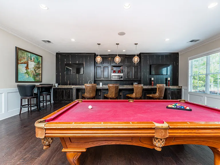 Clubhouse lounge with pool table and kitchen
