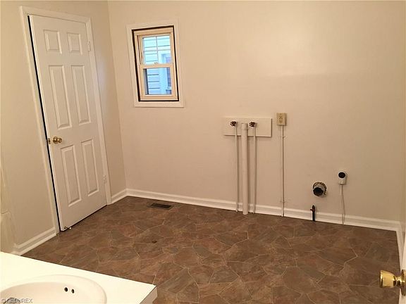 Laundry area located in the 1st floor bathroom