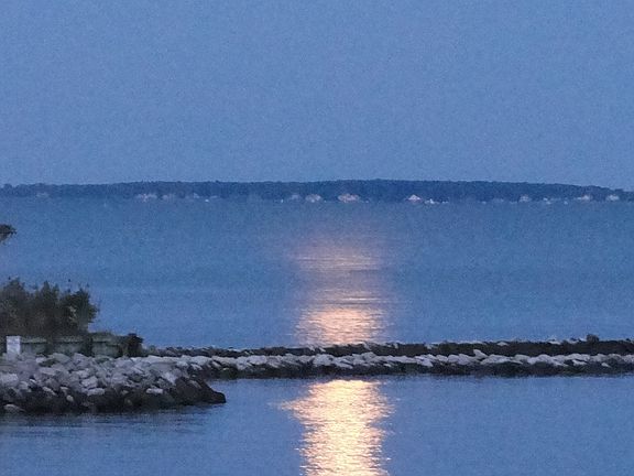 Moonrise, harbor jetty