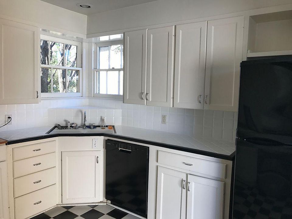 Updated  and open kitchen looks into the living room for ent