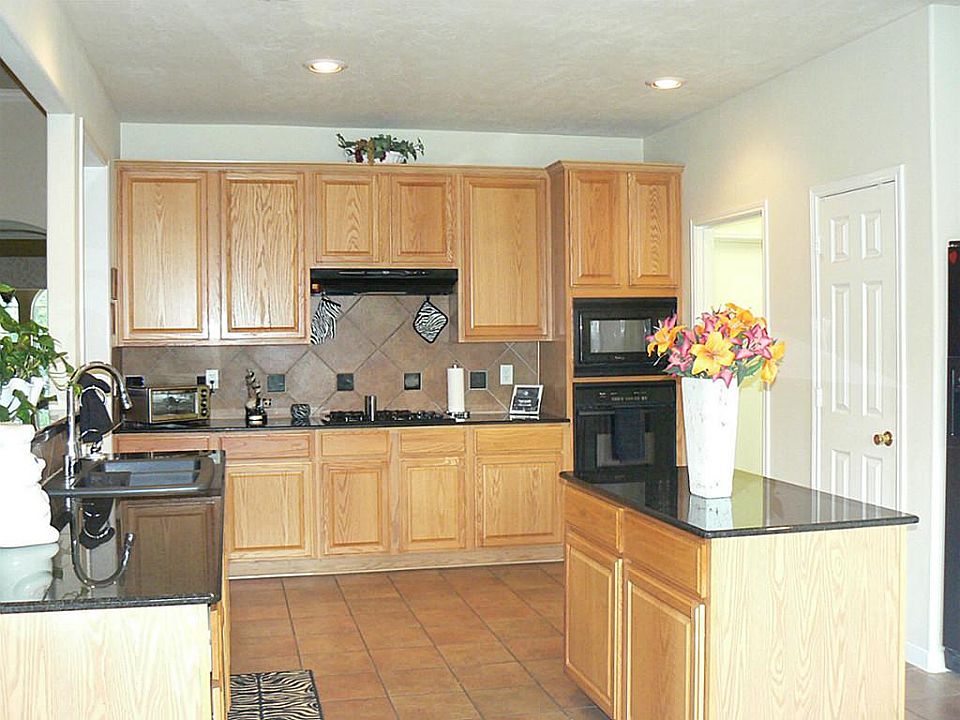 VIEW OF KITCHEN LOOKING FROM BREAKFAST AREA