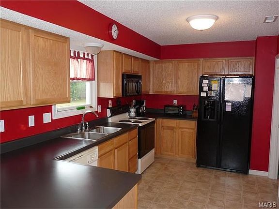 Kitchen has plenty of cabinetry and counter space.