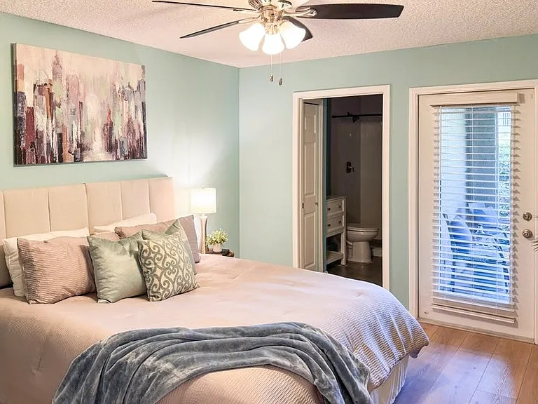 Primary bedroom also opens to the screened patio.