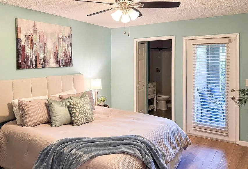 Primary bedroom also opens to the screened patio.