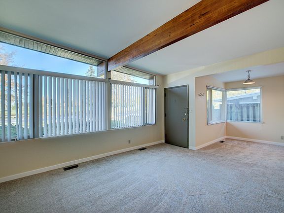 Vaulted ceiling and wall of windows.