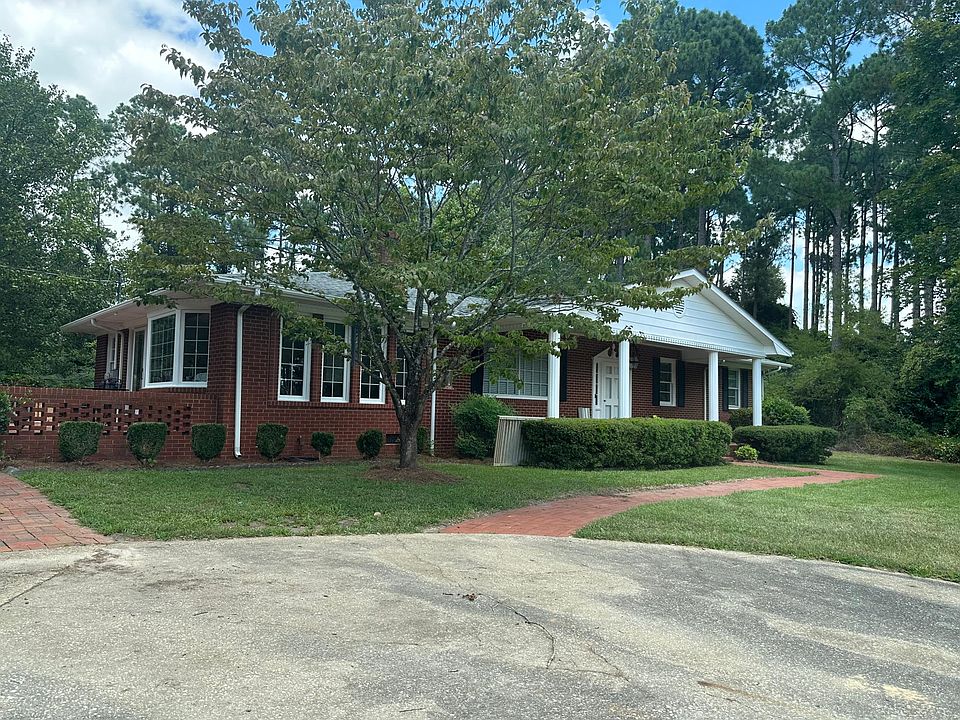 Front of the house with porch. Circle drive, no backing into the street