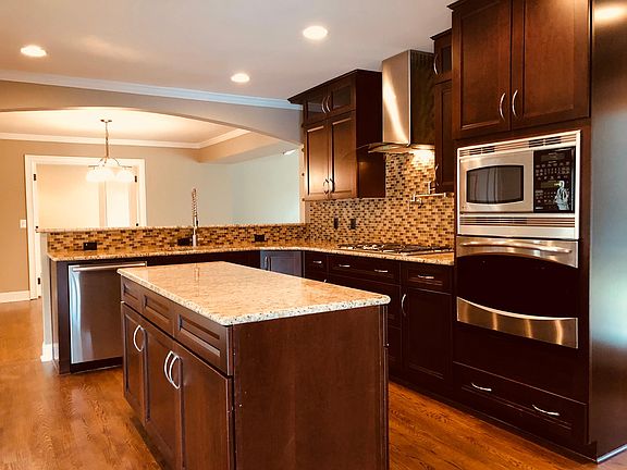 Microwave, oven, island granite countertops. Loads of storage.