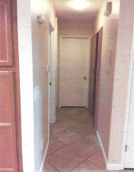 Downstairs Hallway (Hot Water Heater, Laundry Space, Electrical Panel, Doors to Downstairs Bedroom and Downstairs Bathroom)