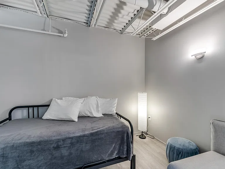 1st Floor bedroom. The bed pulls out into a queen size bed with pillow top mattress.