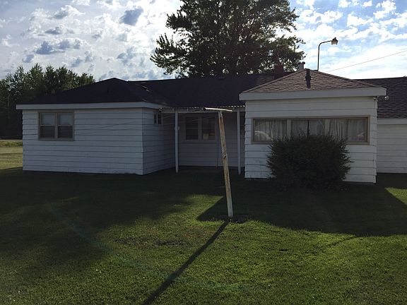 The back of the home over looks a field, there is farm land to the south.