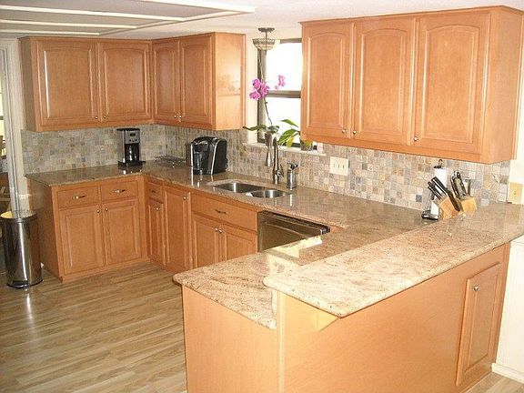 Updated kitchen with granite countertops & slate backsplash