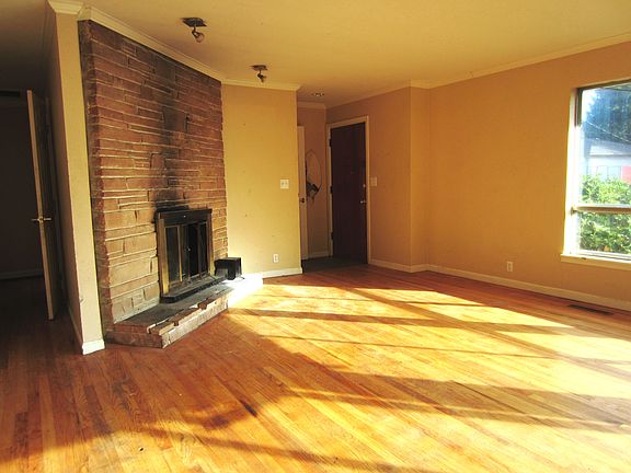 Living Room w/ wood burning fireplace