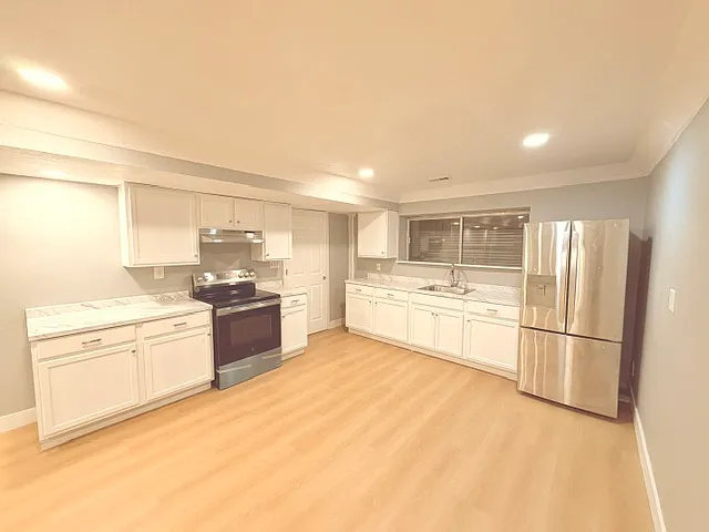 Kitchen ( Lots of New Cabinet space, New Stove, New lighting, fresh paint.)