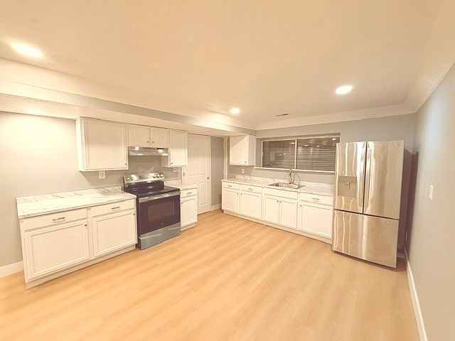 Kitchen ( Lots of New Cabinet space, New Stove, New lighting, fresh paint.)