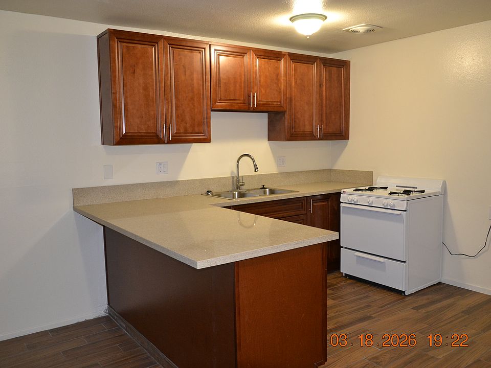 New kitchen cabinets with Quartz countertops. New gas stove.
