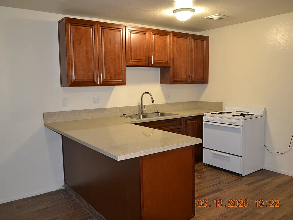New kitchen cabinets with Quartz countertops. New gas stove.