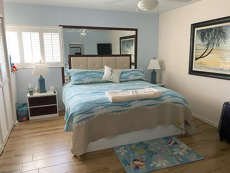 King size bed in the master bedroom with its own TV.