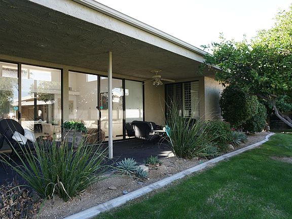 Another view of the back patio, with built in BBQ and mountain views. Faces South East