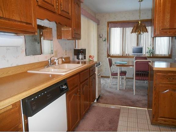 The kitchen has a bright sunny eating area