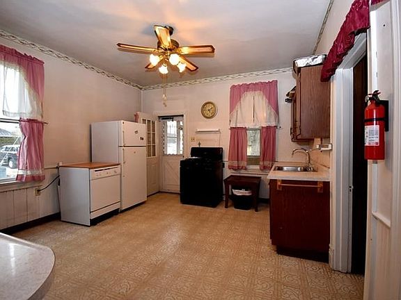 COME IN FROM THE SUNROOM TO THIS OPEN KITCHEN