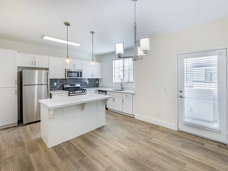 Each unit features a fully updated kitchen with sleek, contemporary amenities, including stainless steel appliances, new cabinetry, and elegant countertops.
