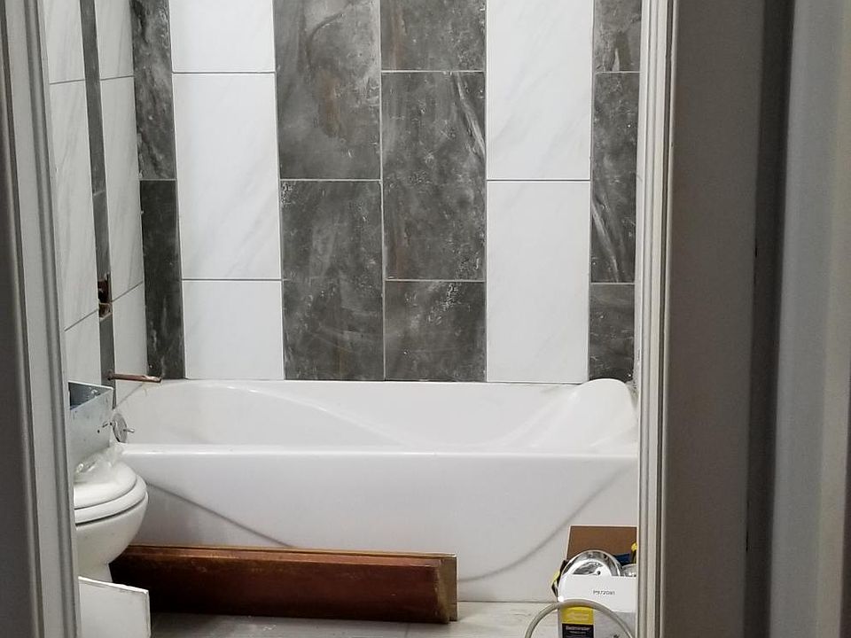 This bathroom is gorgeous with custom tile shower, tiled floor, new vent fan, pedestal sink, shower cutrains will be installed