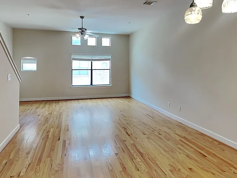 Spacious living room with neut