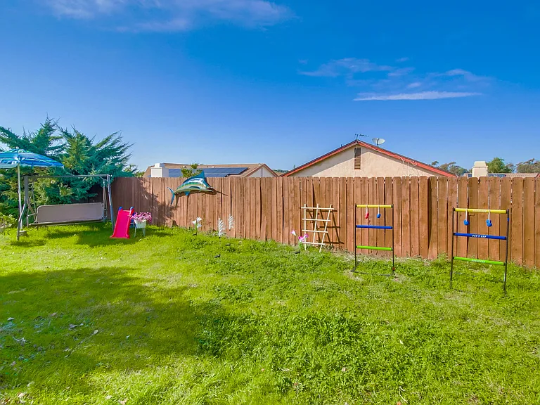 Let your kids and pets run around under the sun in this spacious yard w/ natural grass