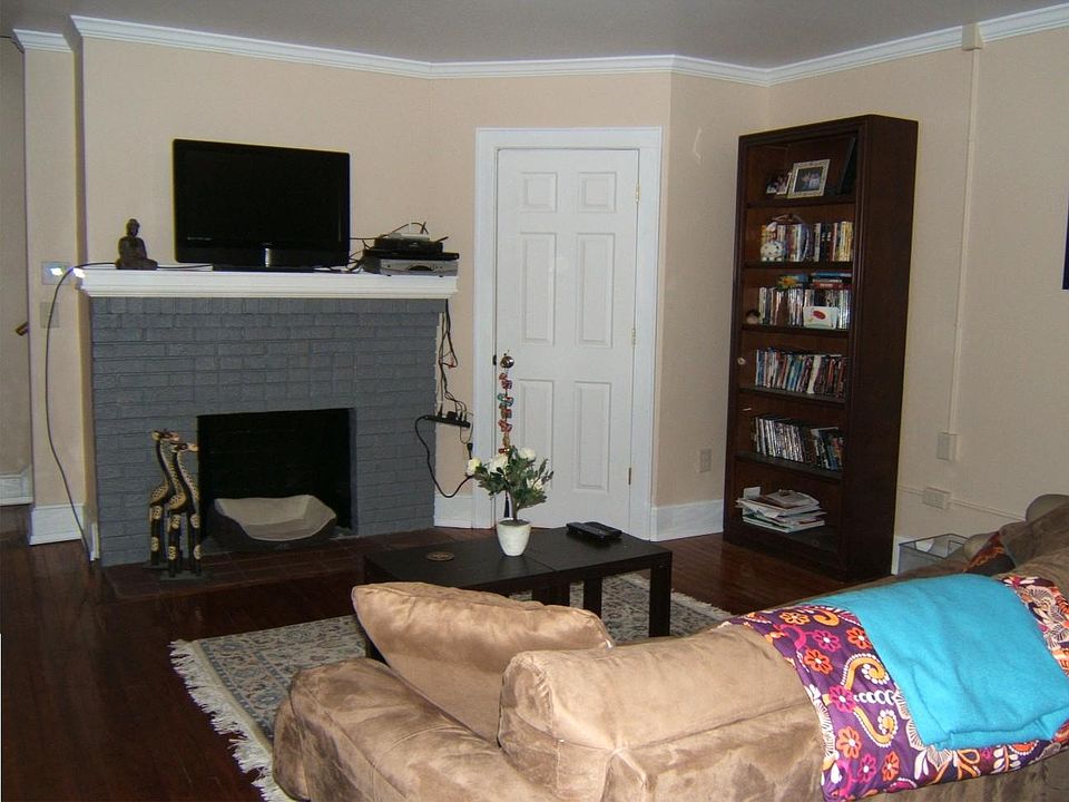 Large living room with decorative fireplace