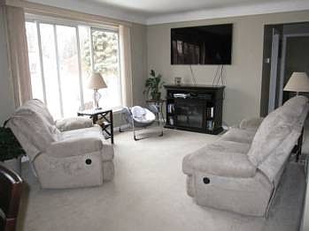The neutral decor in the living room will make moving in easy.
