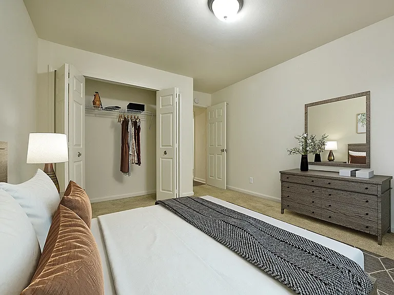 A large bedroom with a closet.