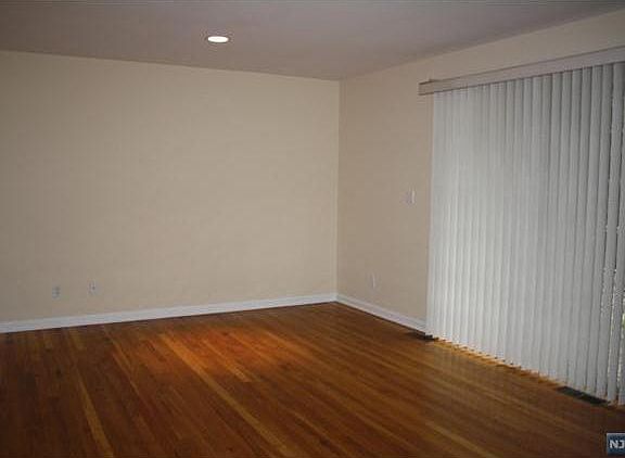 Another view of spacious bedroom with sliders to deck