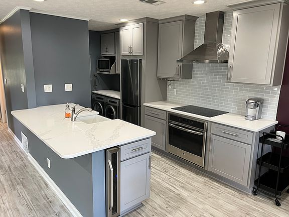 Custom cabinets and GE stainless steel appliances.