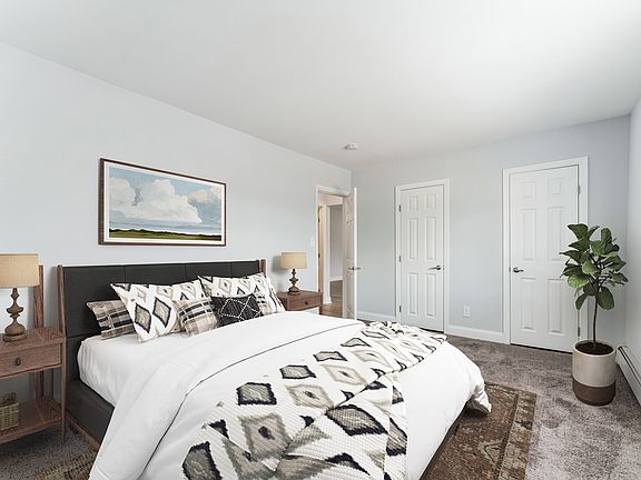 Step into comfort at Mid Island Apartments. This spacious bedroom features modern decor, ample storage, and a serene atmosphere, perfect for relaxation. Elevate your living experienceschedule your visit today!