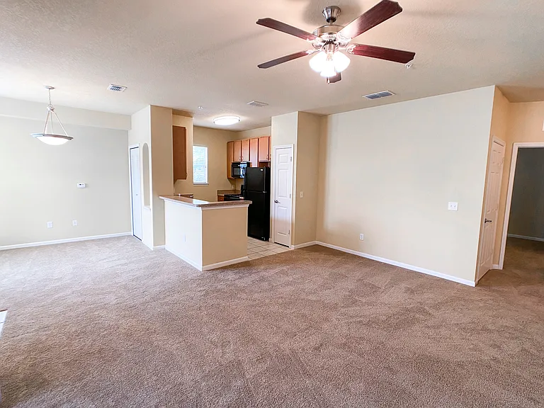 Open Concept Design with Lush Carpet in Living and Dining Rooms Open Concept Design with Lush Carpet in Living and Dining Rooms