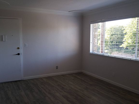 Spacious living room with all new flooring.