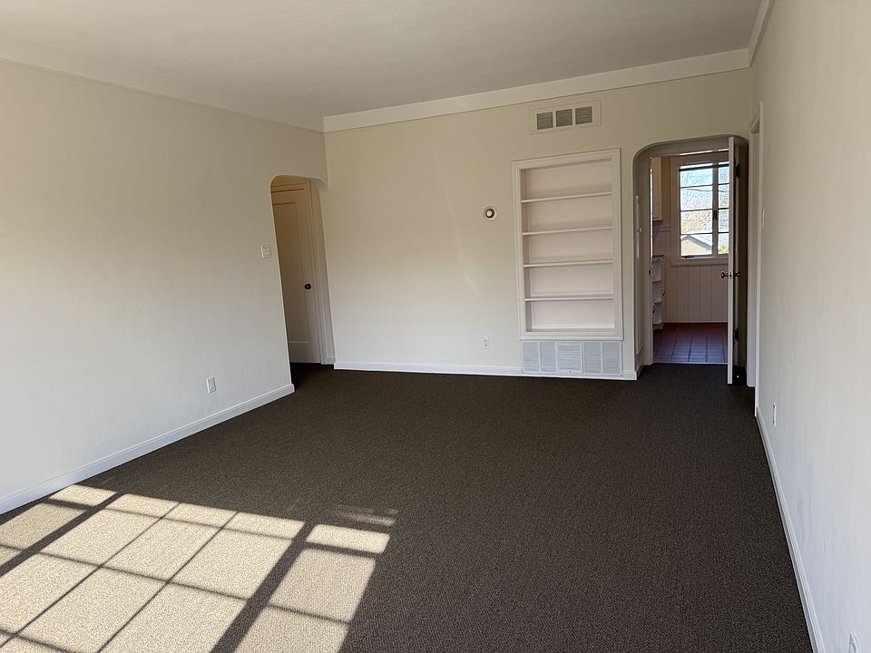 living room, kitchen entry on right, unit entry on left