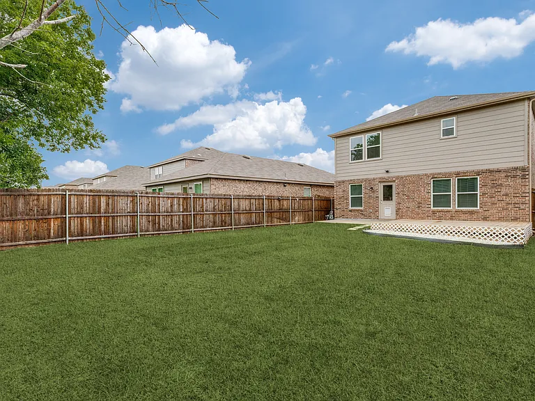 Privacy fence and deck for outdoor furniture.