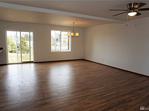 Dining area off family room & kitchen w/access to back yard.  Pic of previously finished home.