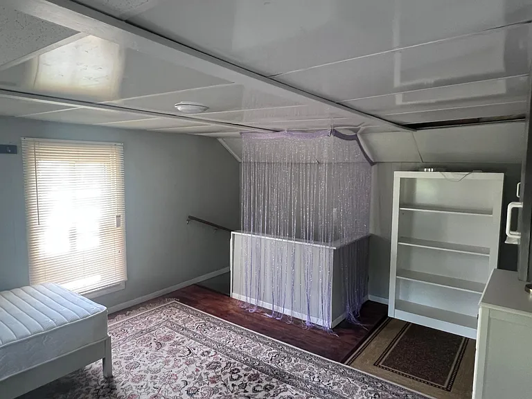 2nd floor furnished bedroom #1 with twin bed, dressers, etc
