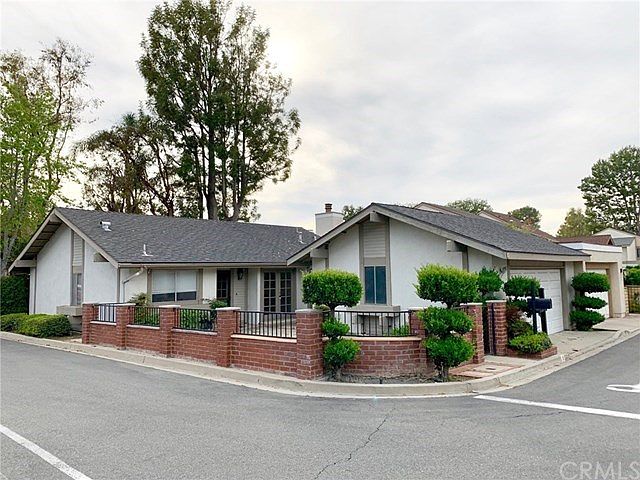 Great corner location with enclosed front yard!